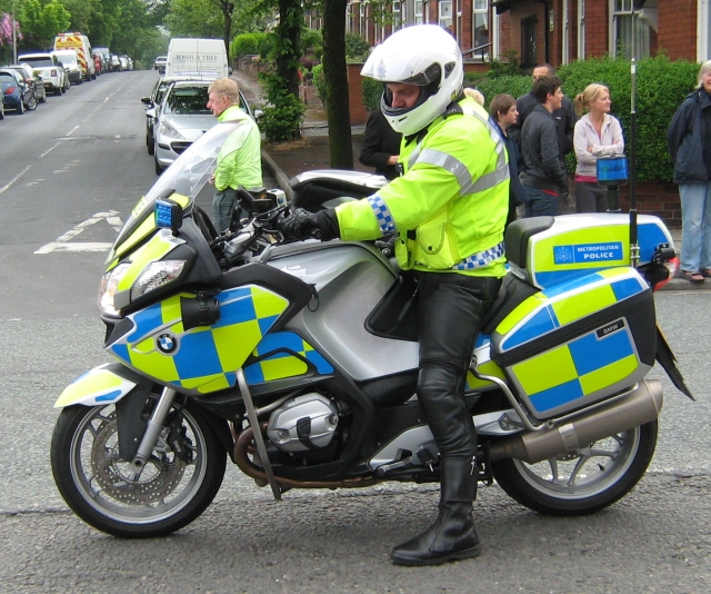 a policeman on his bmw police motorcycle 